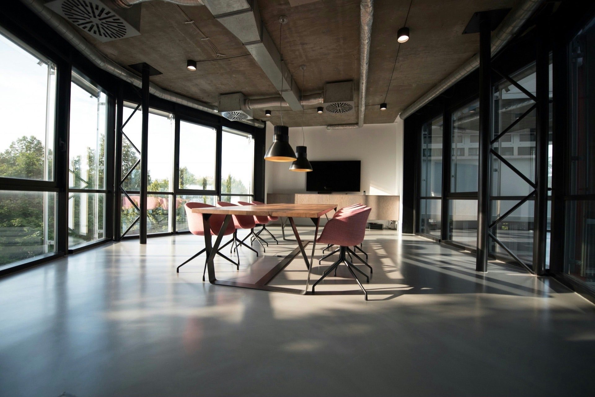 Sunlit conference room with an empty meeting table